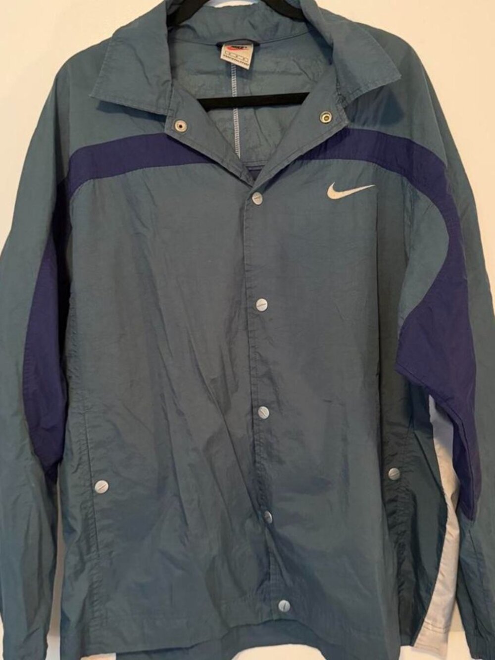 Vintage Nike blue windbreaker jacket with purple and white stripes